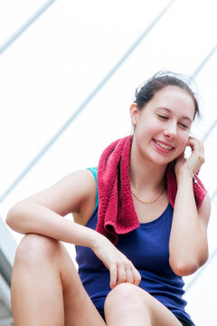 Sport Fitness Two Woman listen to music together after exercise in modern city wear sportswear. Healthy wellness Two Young asian woman smile, laugh using headphone after workout outdoor exercising