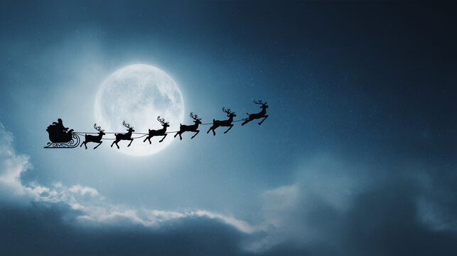 Santa sleigh silhouette placed at the far left of a wide moonlit sky, large empty space to the right, commercial Christmas banner