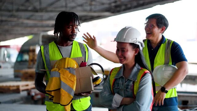 Warehouse Worker Faces Job Loss as Coworkers Offer Comfort and Support at Industrial Loading Dock.
