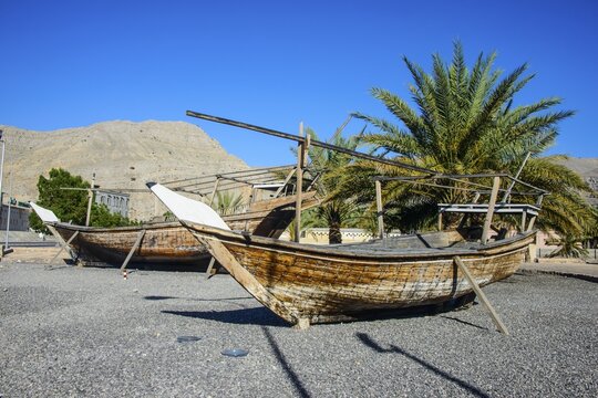 Old dhows in front of Khasab fort, Khasab, Musandam, Oman