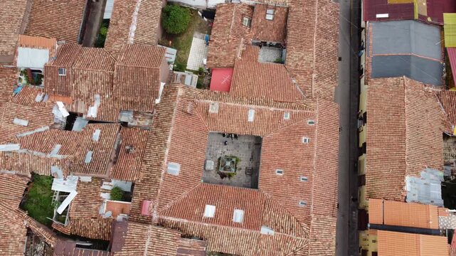 Overhead drone shot of historic terracotta roofs in cusco peru