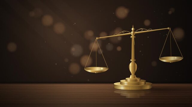 Golden scales of justice on a wooden table representing law and order