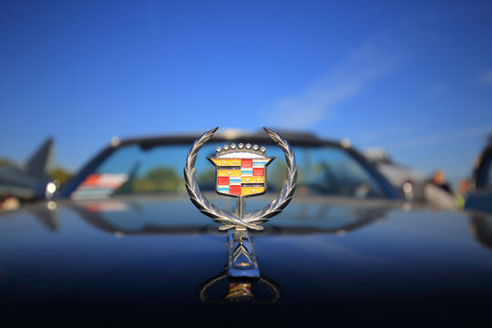 Close up of a classic retro Cadillac chrome hood ornament logo emblem