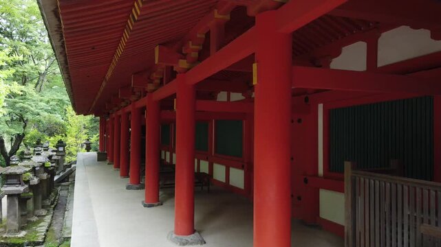 Walking Along Traditional Shrine Corridor at Kasuga Taisha Japan
