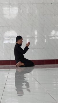 Muslim Man Praying Inside a Mosque