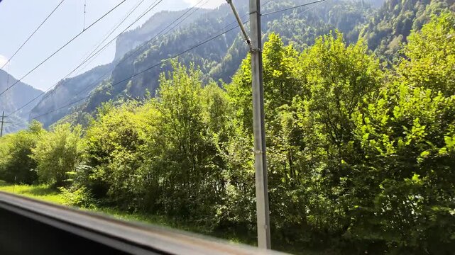 Swiss Federal Railway Train (SBB) passing through the Bernese Oberland of Switzerland towards Interlaken and Lautterbrunan Valley.