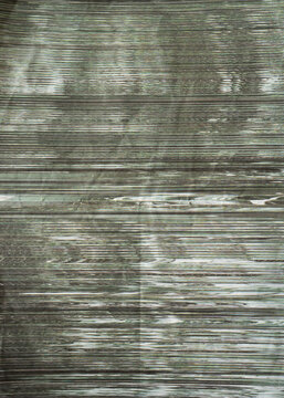 Distorted Black and Green Glitch Scanner Art Pattern Printed on Crumpled Paper Surface Texture
