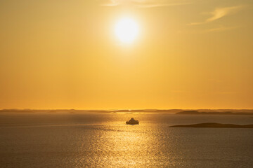 Ferry departs Stokkvågen under sun, Helgeland, Nordland, Norway © Cavan