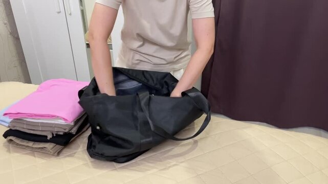 Female organizes her travel essentials, Woman meticulously packs clothes and accessories carefully, She systematically gathers and arranges clothing and necessities for her upcoming journey