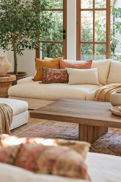 Sunlit Cream Sofa with Patterned Cushions and Kilim Rug in Bohemian Living Room