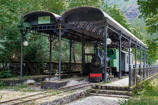 Mokra Gora, Serbia - July 22, 2026: Vintage steam locomotive on the narrow-gauge &Scaron;argan Eight railway, sheltered under a metal shed at historic &Scaron;argan station.