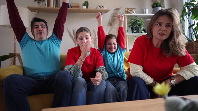 Excited family sitting on the couch while watching a sports match on television, showing mixed emotions of joy and disappointment over the game result