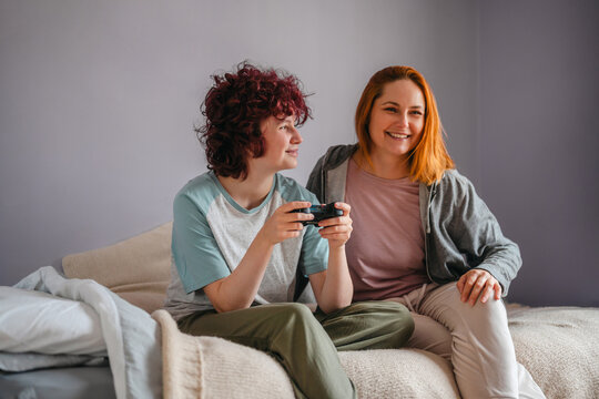 Mother and teenage daughter spending quality time together indoors