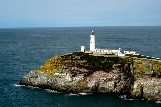 South Stack Lighthouse on a rocky coastal cliff in Wales