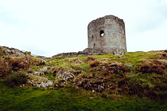 Dolbadarn Castle ruin on a lush green hillside in Wales