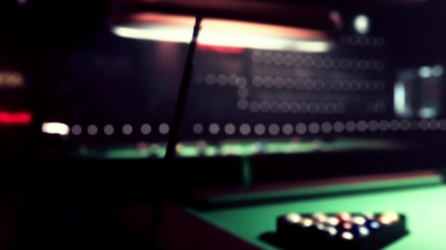 In a vibrant bar, patrons gather around a pool table as a player takes aim. The scene is filled with soft lighting and the sound of laughter, creating a warm and inviting atmosphere.