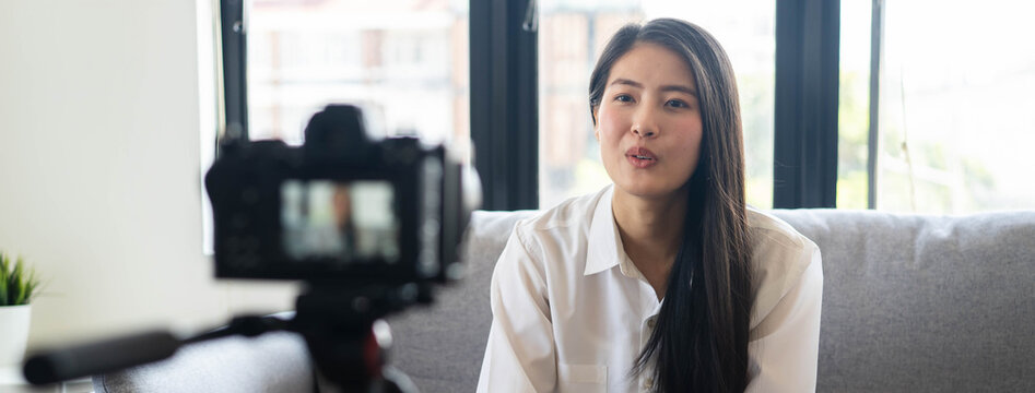 asian teenage talk to camera recording footage for social media clip