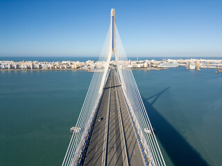 Aerial drone view of the suspension bridge and coastal bay in Cadiz, Spain © Nikolay