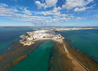 Aerial drone view of Cadiz historic city, cathedral, and coastal fortifications in Spain © Nikolay