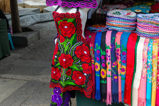 Colorful Embroidered Aprons and Textiles at Mexican Artisan Market Stall