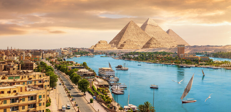 Epic Aswan cityscape panorama at sunset with Nile river and urban skyline on Egypt pyramids travel route