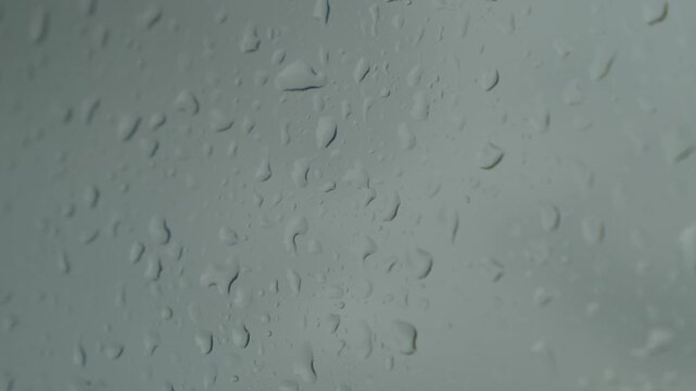 Rain on glass texture, Isle of Skye, United Kingdom (slow motion)
