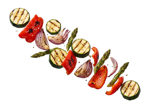 Floating Grilled Zucchini, Red Pepper, Red Onion, and Asparagus on Transparent Background