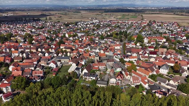 Aerial view above the city  Trebur beside the old town in Germany beside the river Rhine on a sunny noon in autumn.