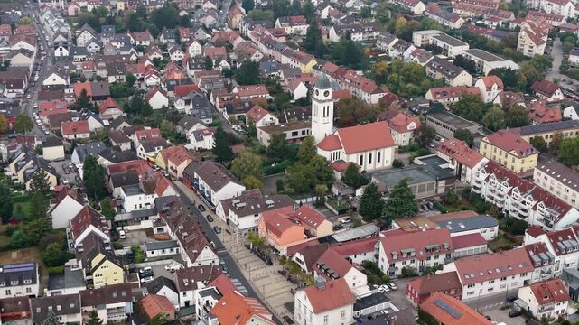 Aerial view above the city  Wallstadt beside the old town in Germany beside the river Rhine on a sunny noon in autumn.