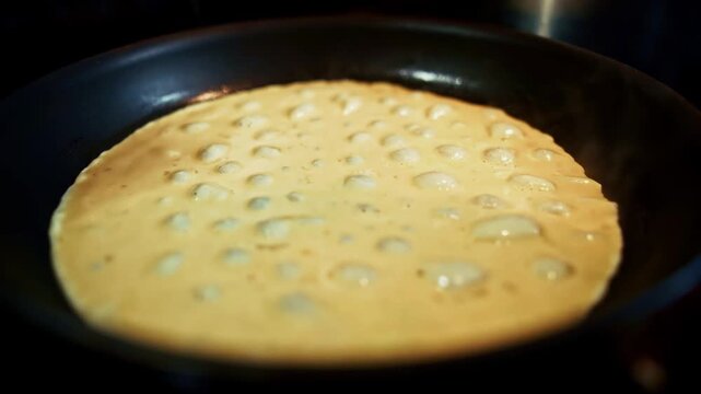 Cooking Omelet In Hot Frying Pan During Breakfast Preparation