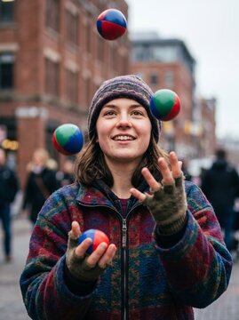 Young woman juggling colorful balls in a lively urban setting  