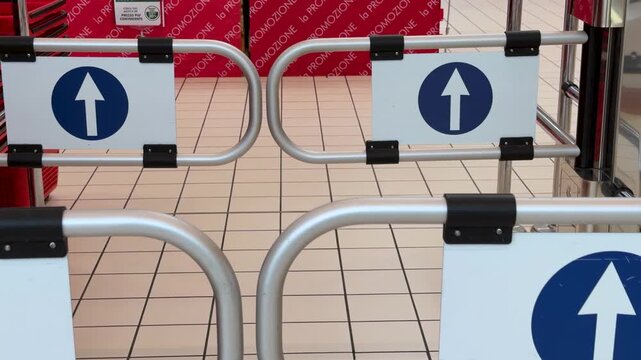 Supermarket Entrance Turnstile Gates with Arrow Direction Signs