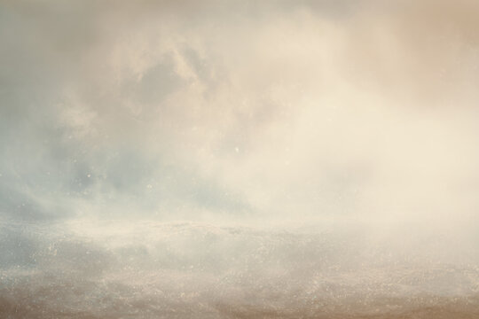 Artistic, ethereal background featuring soft mist, pale tones, and a dreamy luminous atmosphere.