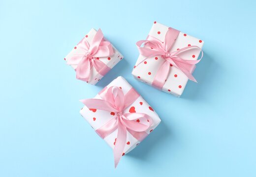 Gift boxes on blue background, top view