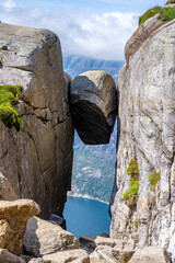 Kjeragbolten boulder wedged in mountain crevice above Lysefjord, Norway © FelixB