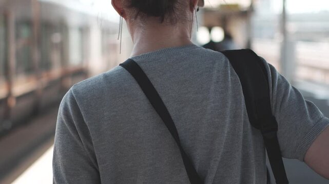 Rear View of Woman Walking on Train Station Platform in Slow Motion