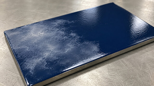 Cloudy Amine Blush on Cured Epoxy Coated Steel Test Panel