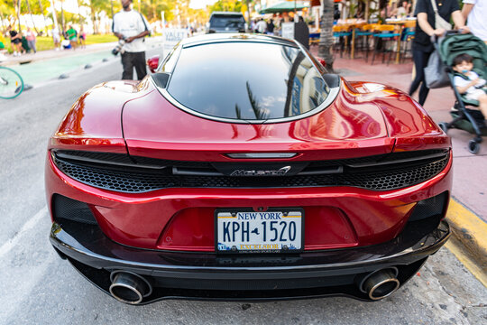 Miami, Florida, USA - April 22, 2025: McLaren GT 2022 coupe car. Luxury coupe sport car McLaren GT. Car McLaren GT parked outdoor. Red sportscar, rare view.