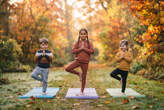Children Practicing Yoga Outdoors in Autumn

