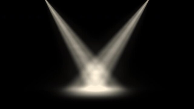 Two stage spotlights sweeping and crossing then meeting at center