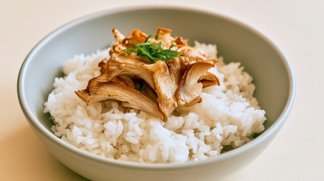 Savory Rice Bowl Topped with Fried Maitake Mushrooms and Green Onion Garnish