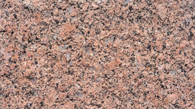 Coarse grained pink Rosa Porri&ntilde;o granite stone texture with large orthoclase feldspar crystals background