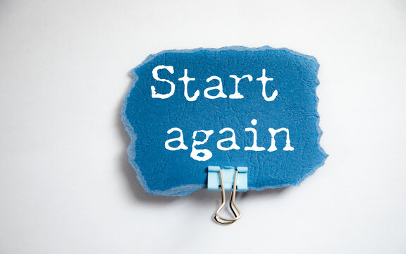 Inspiring Message 'Start Again' on Notebook