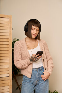 A young woman uses a smart assistant as remote working with a mindful rhythm