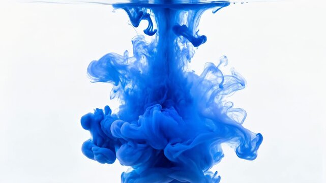 Blue ink cloud dissolving in clear water against a white background, creating abstract smoke