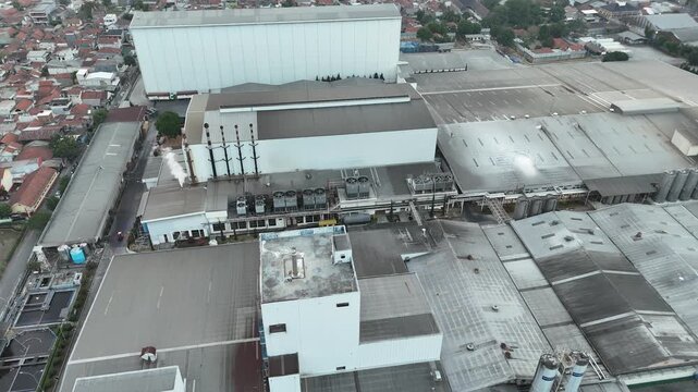 Aerial view of large industrial infrastructure, factories, and manufacturing facilities in West Java