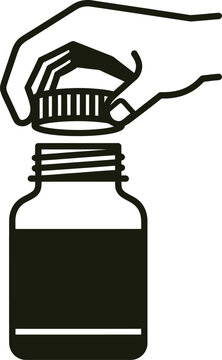 Human hand opening a bottle cap on glass container with medicine