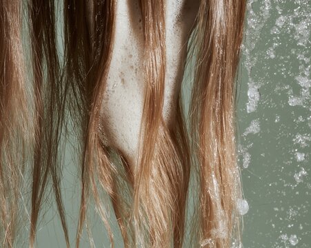 long dark blonde hair strands, ends visibly dry, frayed and uneven with split tips