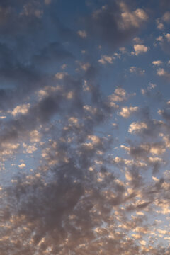 Dramatic clouds in blue sunset sky