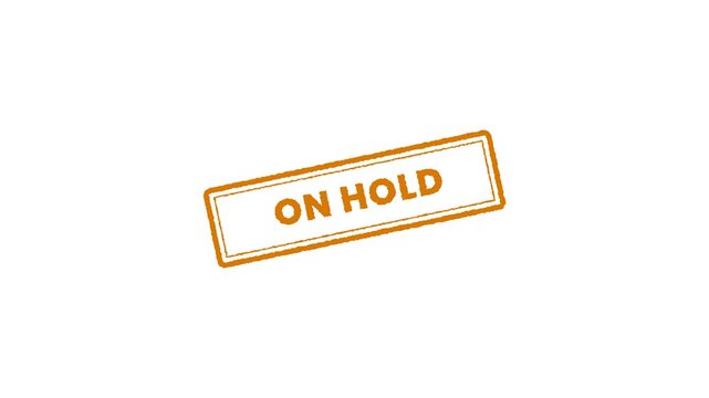 Animated rubber stamp featuring ON HOLD text on a white background.